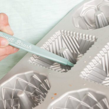 Closeup of Bundt Cleaning Tool showing pick end of tool being used in cavity of a pan