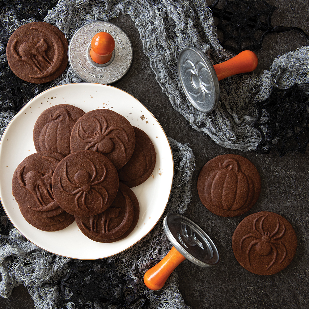 Baked Halloween stamped cookies in festive scene