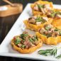 Cooked timbales filled with mushrooms, beef, chives, and rosemary