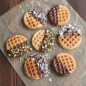 Cooked mini waffles dipped in chocolate