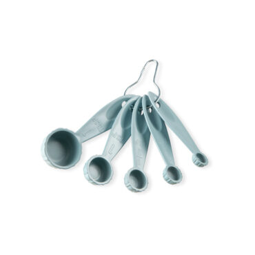Set of 5 Nordic Ware Bundt measuring spoons in translucent sea glass blue, nested together showing fluted design