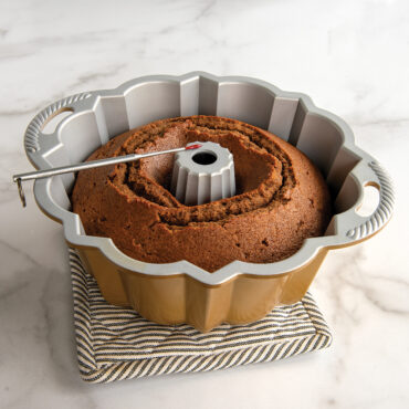 Reusable Bundt® Cake Thermometer on done baked Bundt cake in Bundt pan
