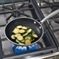 sliced zucchini in Flare saute pan on stove top