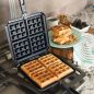 Waffler on stovetop with cooked waffle