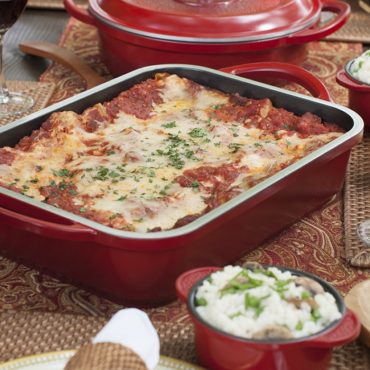 Baking pan with cooked lasagna, cocoettes with rice