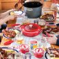 Stock pot on dinner table, braiser, plated lobster