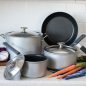 Cookware set on counter with vegetables