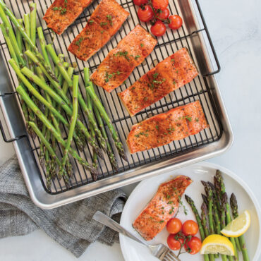 Baked salmon fillet with vegetables on Nordic Ware Extra Large Oven Crisp aluminum baking tray