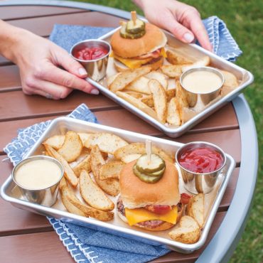 Trays with burgers and fries