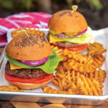 Grill tray with two hamburgers, fries