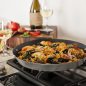 Cooked paella in pan on stovetop