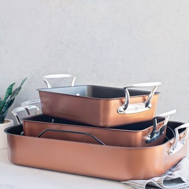 Copper roaster collection, 3 roaster sizes stacked with towel