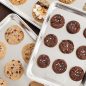 Multiple sheet pans with baked cookies