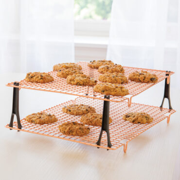 Nordic Ware stackable cooling grids with golden baked cookies, black legs