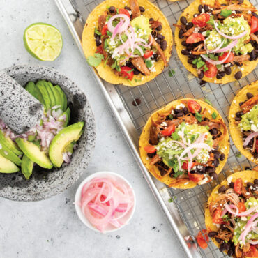 Mini tacos with ingredients prepped on Nordic Ware wire grid rack