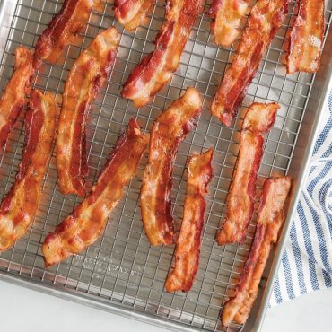 Baked bacon on baking grid in sheet pan