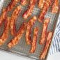 Baked bacon on grid in half sheet pan