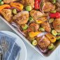 Roasted chicken and vegetables in pan, chicken and vegetables on plate