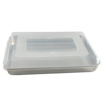 Naturals® High Sided Sheetcake Pan with lid on, side angle