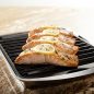 Broiled salmon steaks with dill and lemon on grill pan