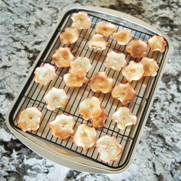 Dried apple slices on bacon pan
