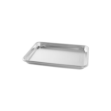 Nordic Ware aluminum quarter sheet baking pan, rectangular with raised rim, natural silver finish shown at angle