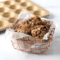 Naturals® Nonstick 24 Cavity Petite Muffin Pan with basket of granola muffins