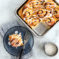 Cinnamon rolls baked in 9" Square Cake Pan, one cut and plated