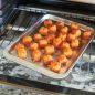 Baked tater rounds on compact pan in toaster oven
