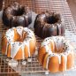 Angled baked 3 Cup Bundts, chocolate and vanilla with glazes