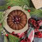 Holiday baked Bundt with green wreath and wrapped present