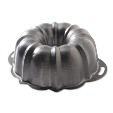 Nordic Ware ProForm aluminum bundt pan with side handles, fluted design, light silver finish, side view