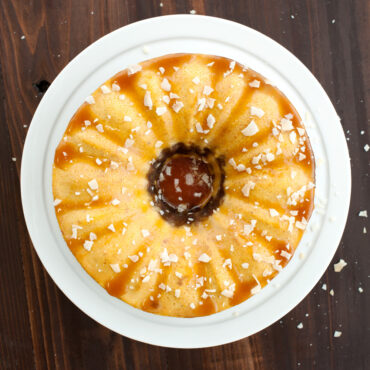 chocoflan dessert baked in Nordic Ware bundt springform pan with caramel drizzle, overhead view