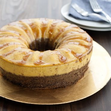Chocoflan baked in Bundt springform pan on plate with caramel