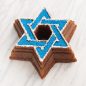 Decorated Star Of David Bundt® cake on marble surface
