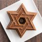 Baked Cinnamon Star Of David Bundt® cake on a square plate