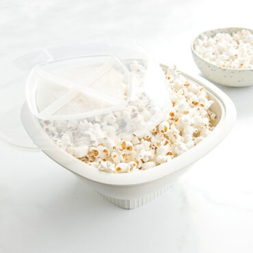 Nordic Ware white microwave popcorn popper filled with fluffy popped kernels
