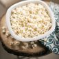 Close-up of popped popcorn in bowl on table