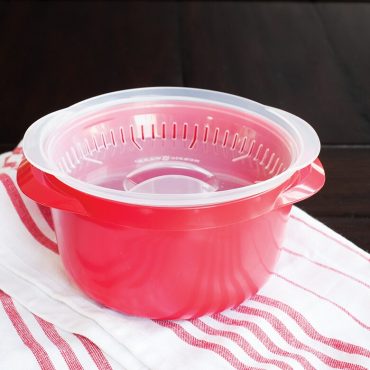 Microwave safe deep container, clear lid upside down in container, vents for draining liquid from container