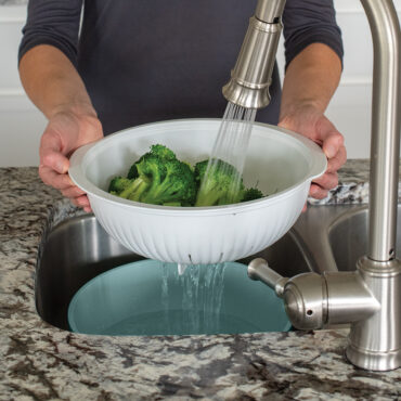 3-in-1 Colander, Steamer, and Bowl rinsing broccoli