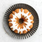 Overhead image of vanilla Bundt Cake baked in Original Bundt Pan with a white glaze.