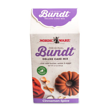 Nordic Ware Cinnamon Spice Bundt cake mix box with purple branding and bundt cake image