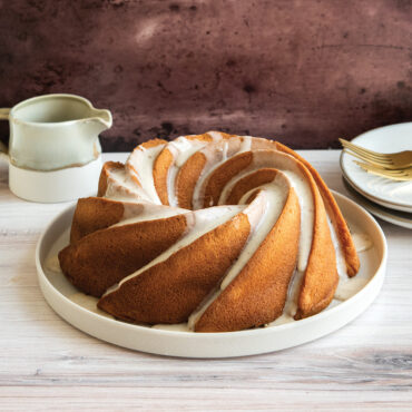 Angled baked Heritage Bundt cake on platter