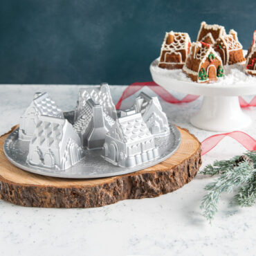 Golden brown gingerbread houses from Nordic Ware Cozy Village pan with white icing details