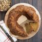 Top view of spice wreath cake on wood serving plate