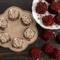 Pan on surface with baked red velvet rose cakes