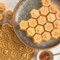 Baked honeycomb lemon cake with cut pieces, with pan