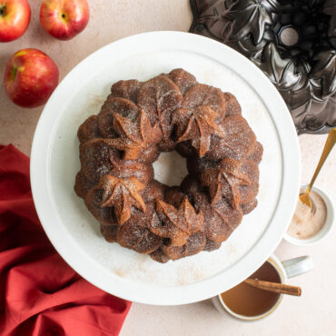 Harvest Leaves Bundt on cake stand with apples and pan, overhead