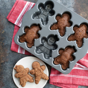Nordic Ware aluminum gingerbread kids cakelet pan with six child-shaped cavities, natural silver finish
