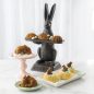 Easter Display and decorations with plated baked bunny cakes, egg cakes, and shortbread basket cakes.